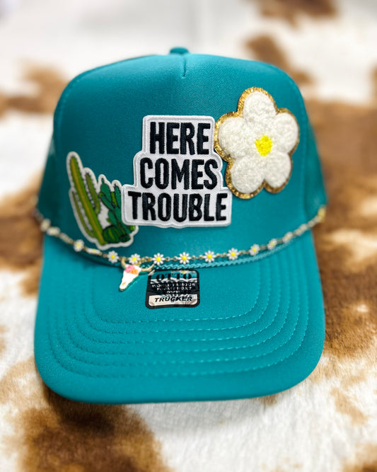 here comes trouble trucker hat