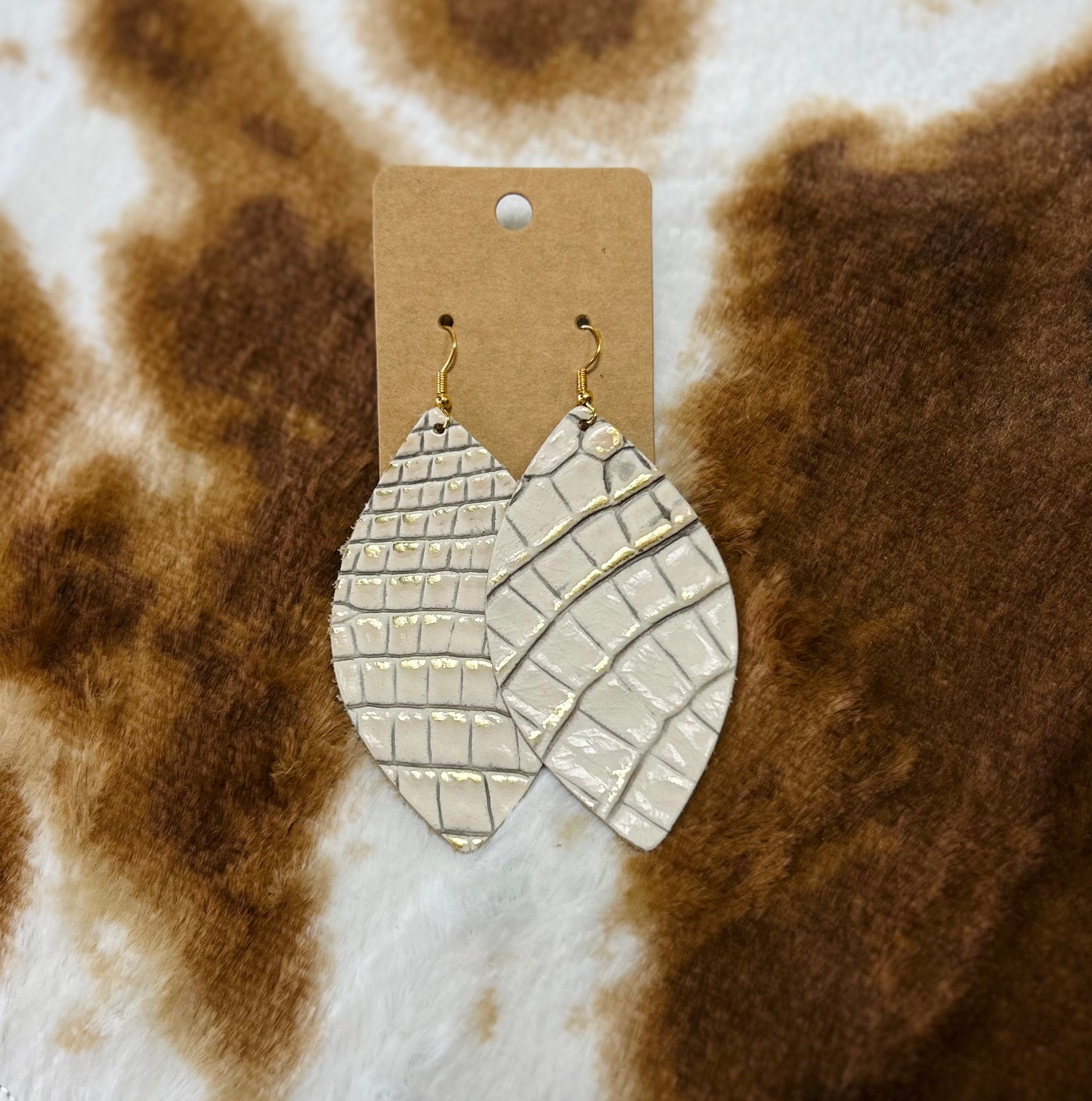 white + gold gator earrings